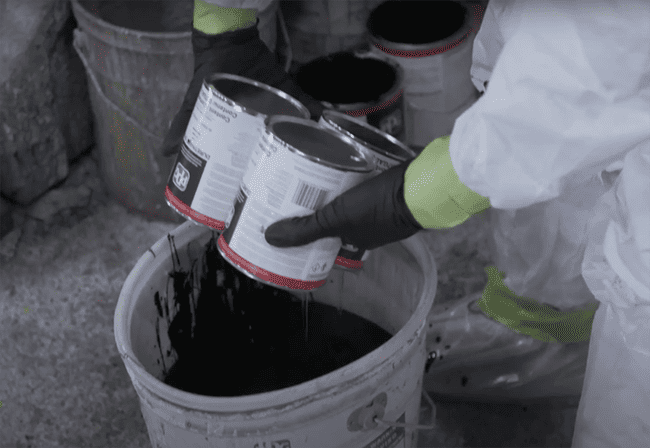 powder coating poured into a bucket